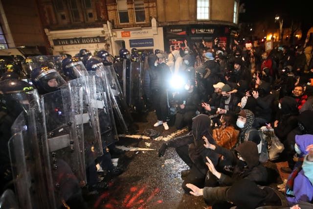 <p>Riot police could be seen pushing people to the ground with their shields in videos posted on social media</p>