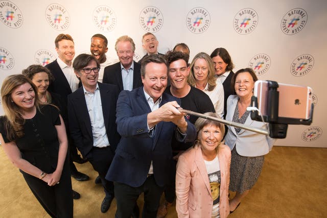 <p>David Cameron, chair of patrons for National Citizen Service (NCS), helps arrange a selfie with the new board of patrons and NCS grad Cameron Duncan Lyon, 18, at Google HQ in London, in July 2017</p>