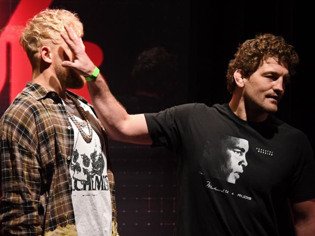 <p>Ben Askren shoves Jake Paul as they face off during a news conference</p>