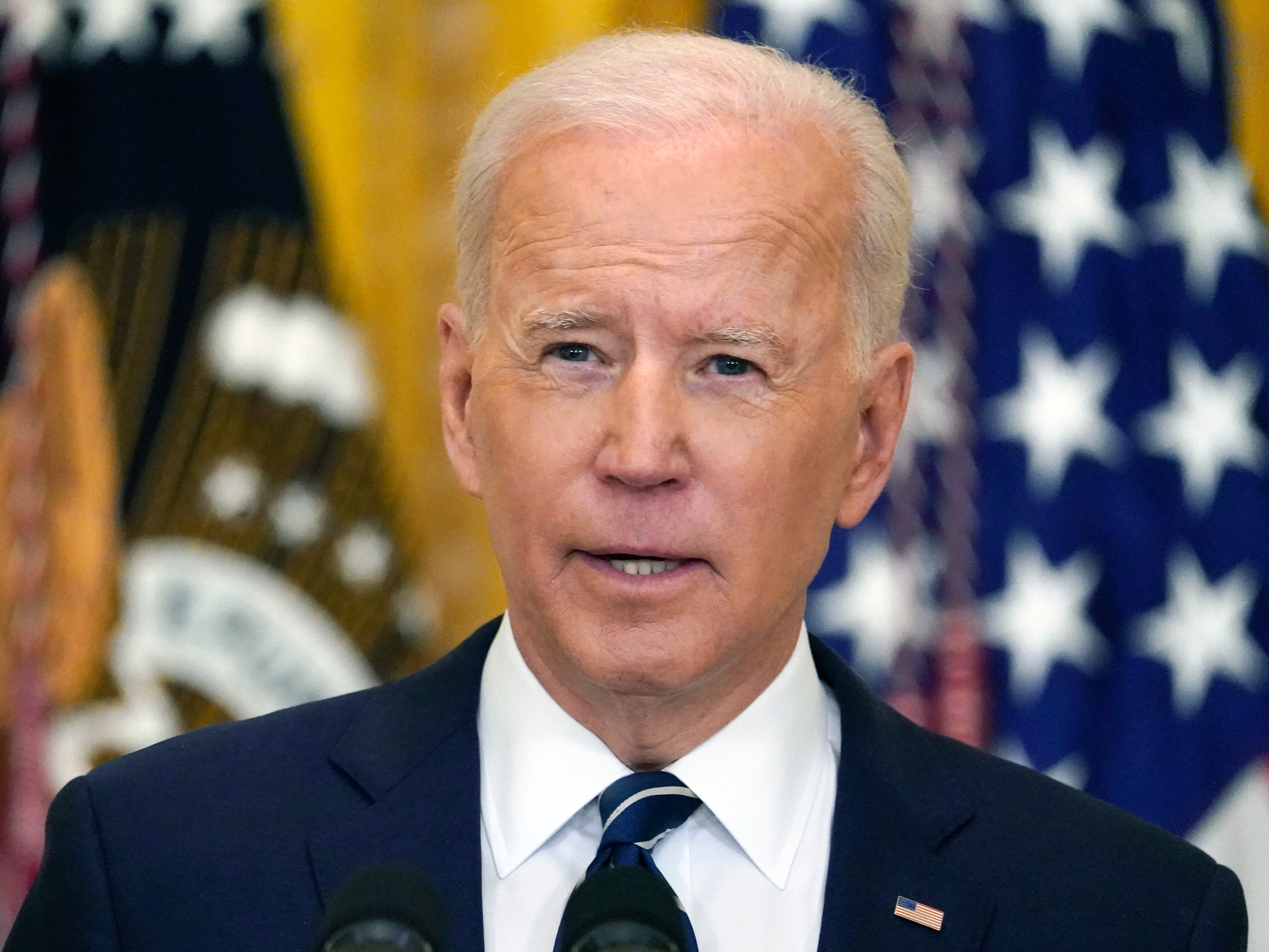 President Joe Biden speaks during a news conference in the East Room of the White House in Washington