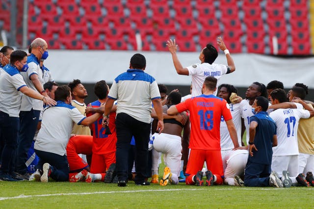 <p>Honduras players and staff celebrate beating the United States</p>