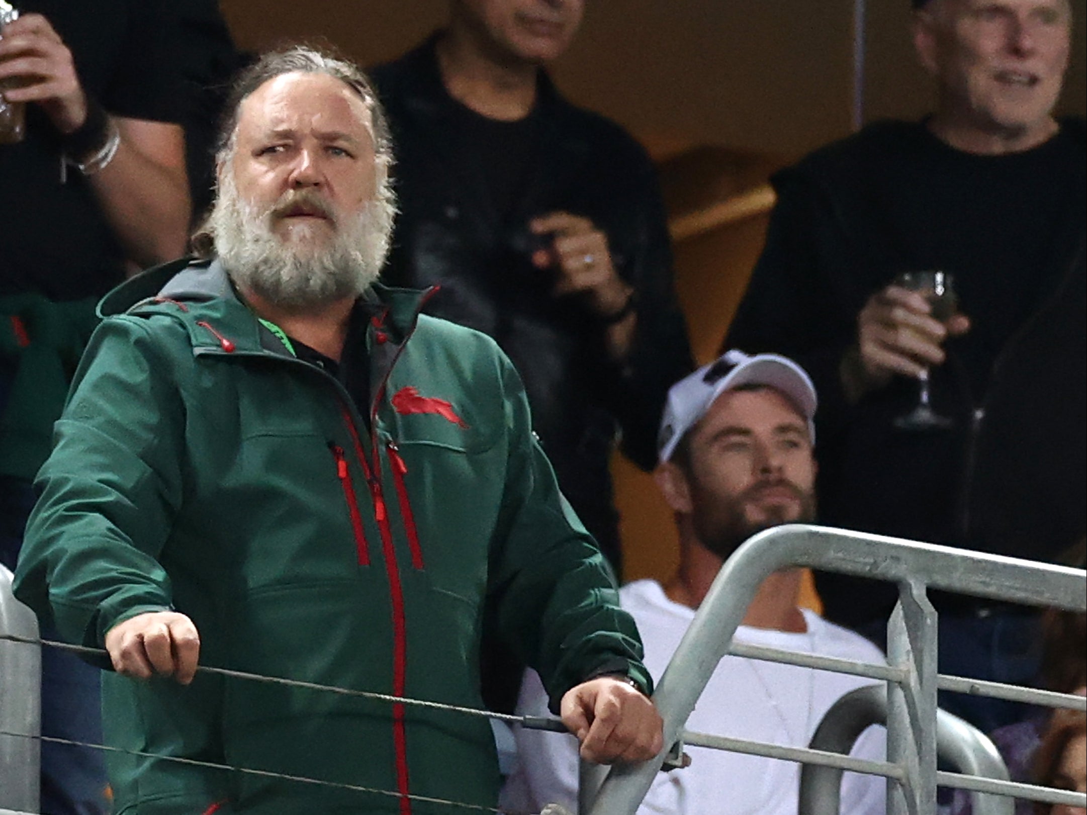 Russell Crowe at a rugby match on 26 March 2021 in Sydney, Australia, next to Chris Hemsworth