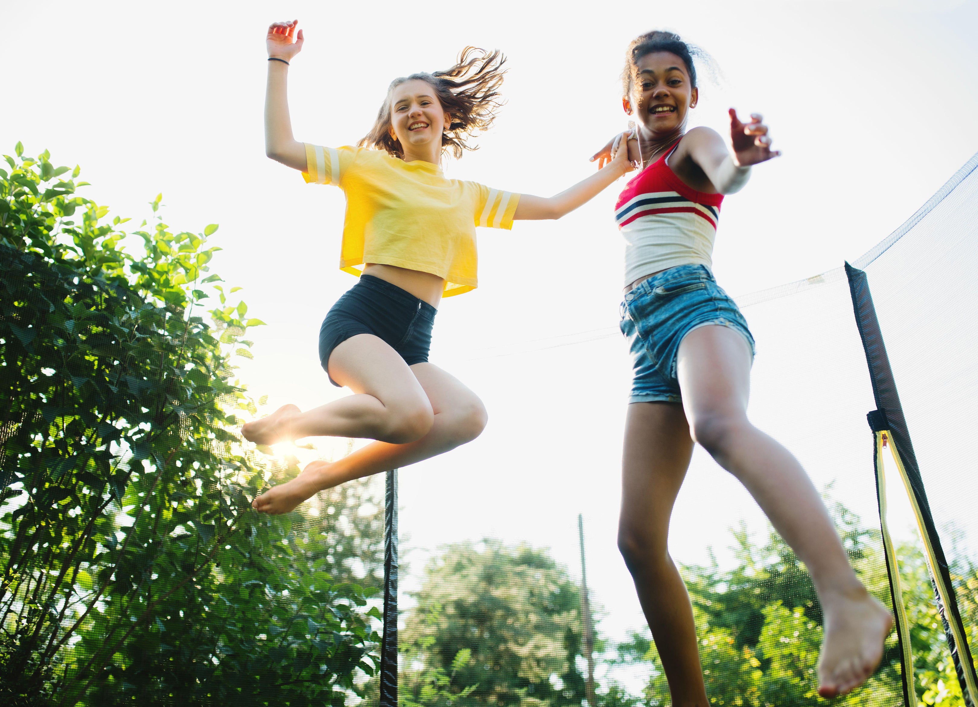 teenage girls on a trampoline