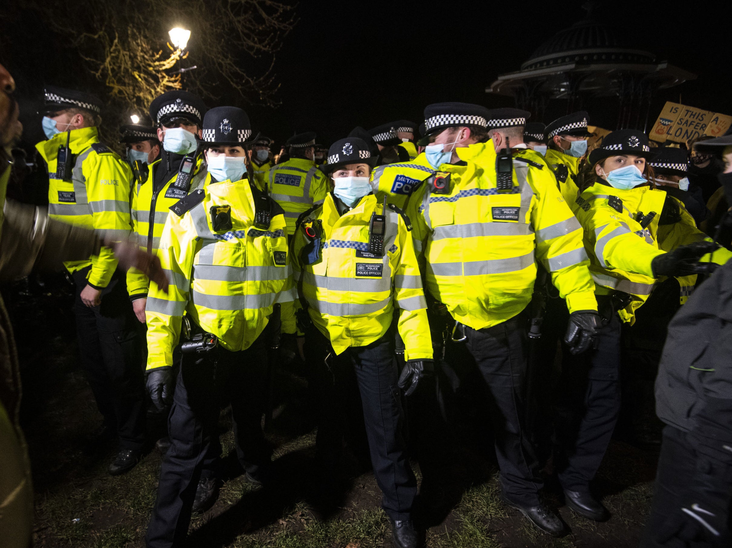 Police clash with people at the Sarah Everard vigil in Clapham Common, London