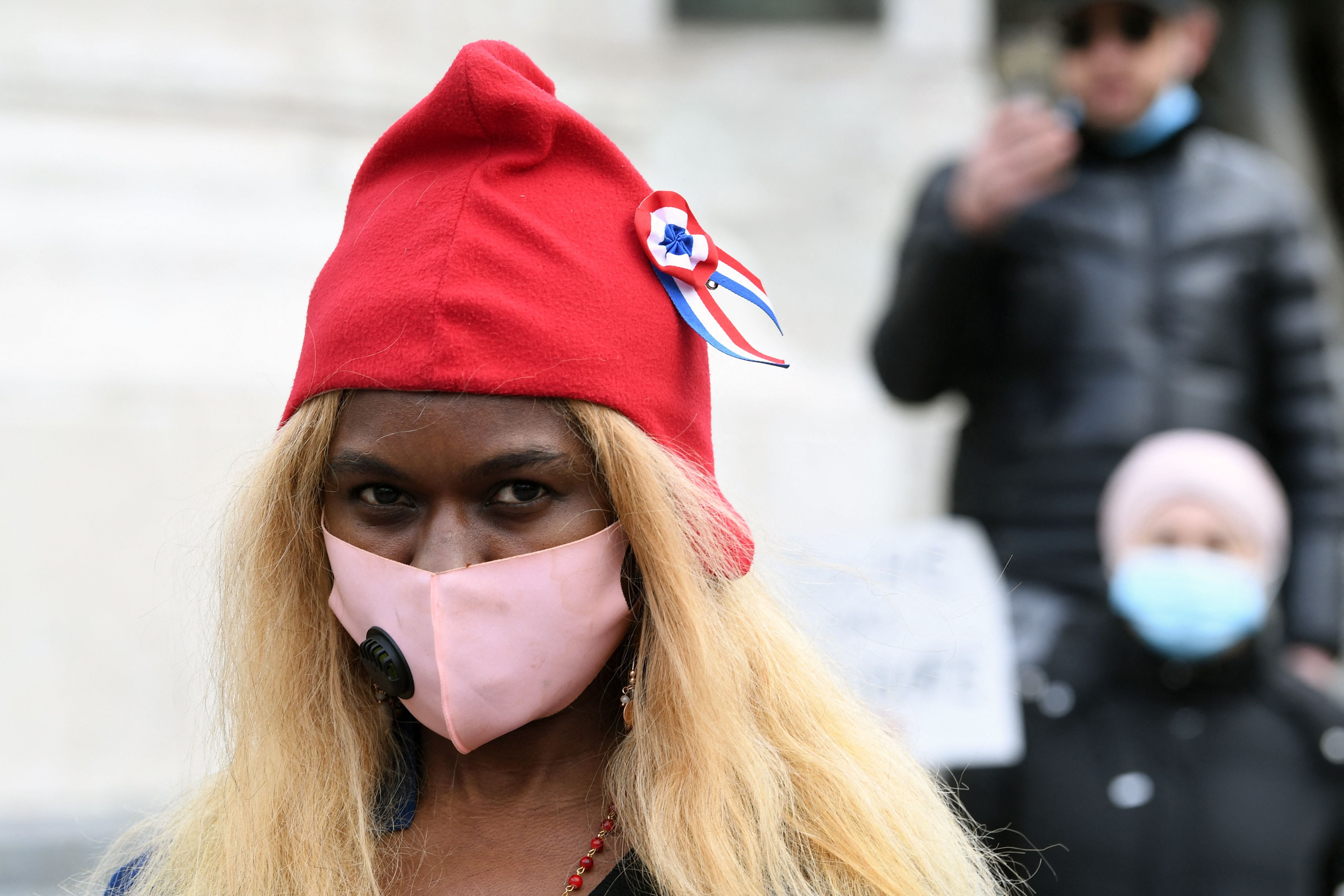 A protester dons a Phrygian cap, depicted on statues and imagery of France’s Marianne, during a demonstration in Paris earlier this month