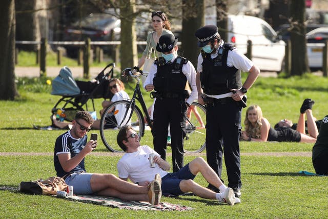 <p>People enjoy the weather at Clapham Common, in London</p>