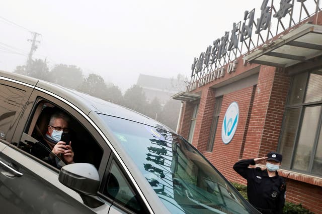 Dominic Dwyer, a member of the World Health Organization (WHO) team tasked with investigating the origins of the coronavirus sits in a car arriving to Wuhan Institute of Virology in February 2021