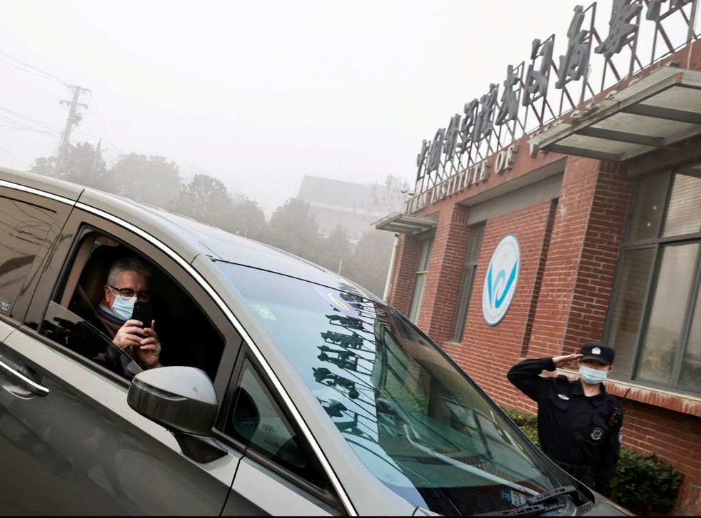 Dominic Dwyer, a member of the World Health Organization (WHO) team tasked with investigating the origins of the coronavirus sits in a car arriving to Wuhan Institute of Virology in February 2021