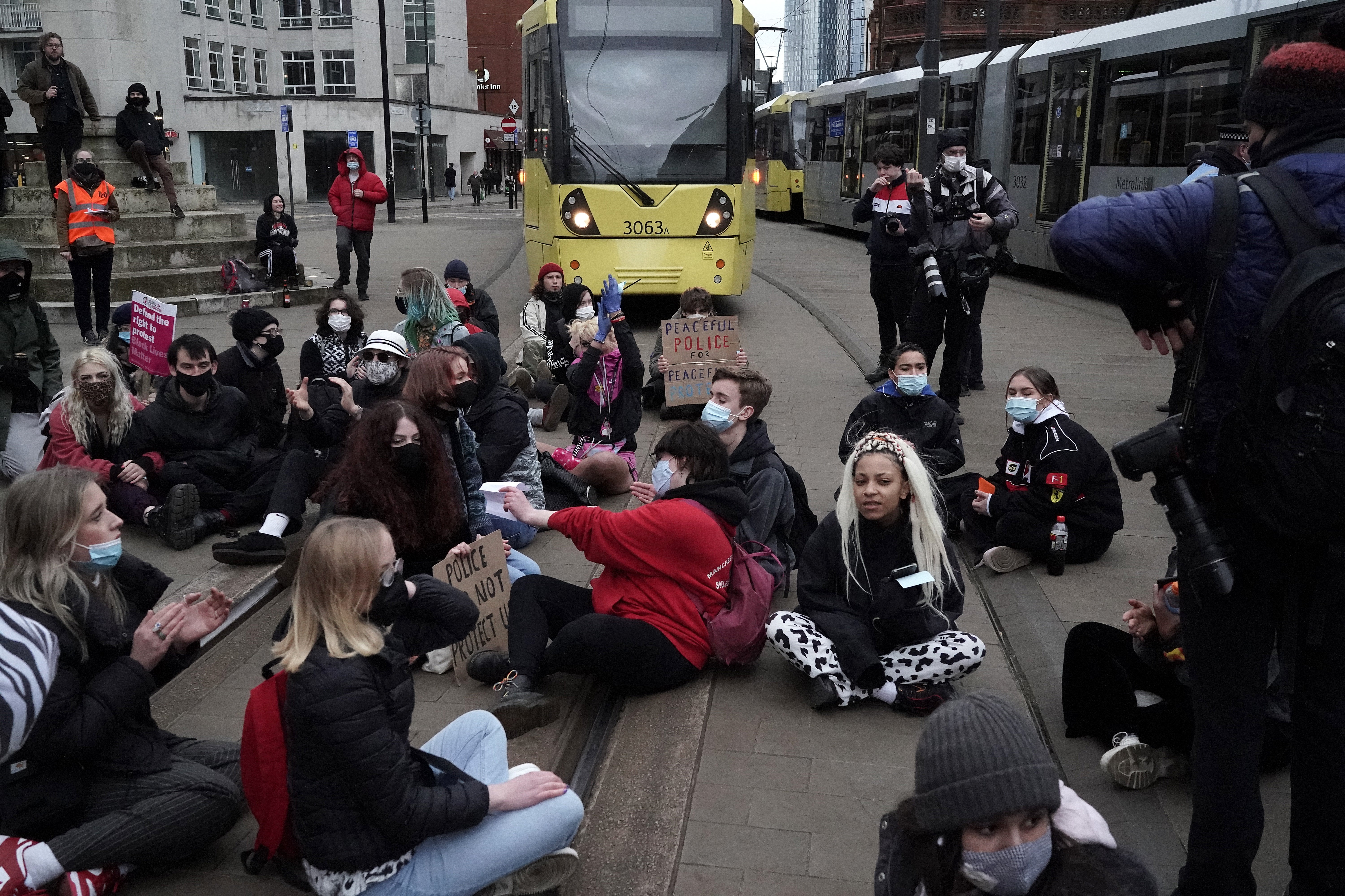 Demonstrators block the tram tracks during a ‘Kill the Bill’ protest in Manchester City Centre on 27 March, 2021