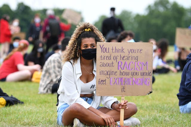 <p>A woman in Hyde Park during a ‘Black Lives Matter’ protest following the death of George Floyd</p>