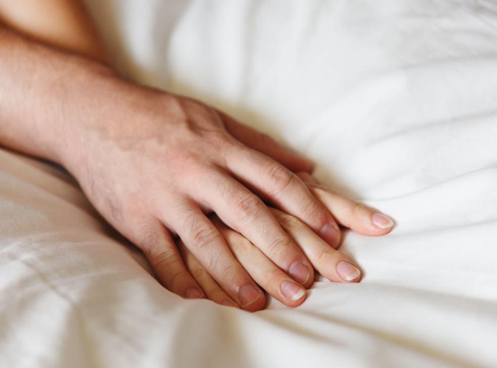Woman and man holding hands