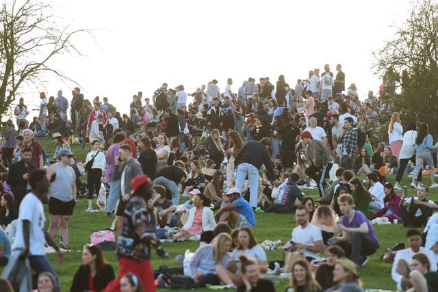 <p>People enjoying the evening sunlight on Primrose Hill, north London, earlier this year</p>
