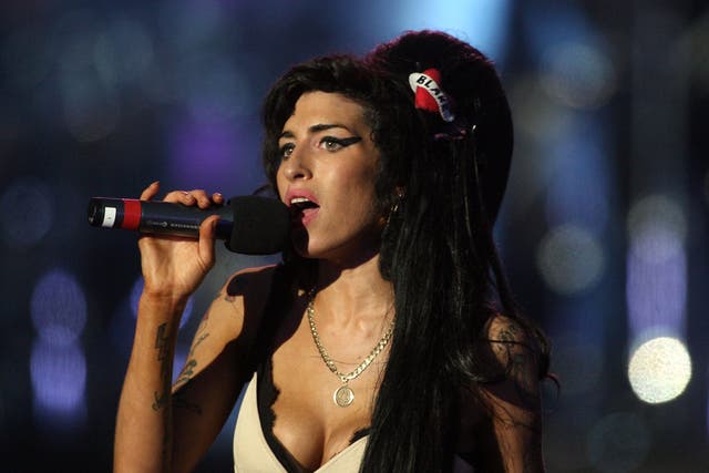 <p>File: Amy Winehouse performs during the 46664 concert in celebration of Nelson Mandela's life at Hyde Park in 2008</p>