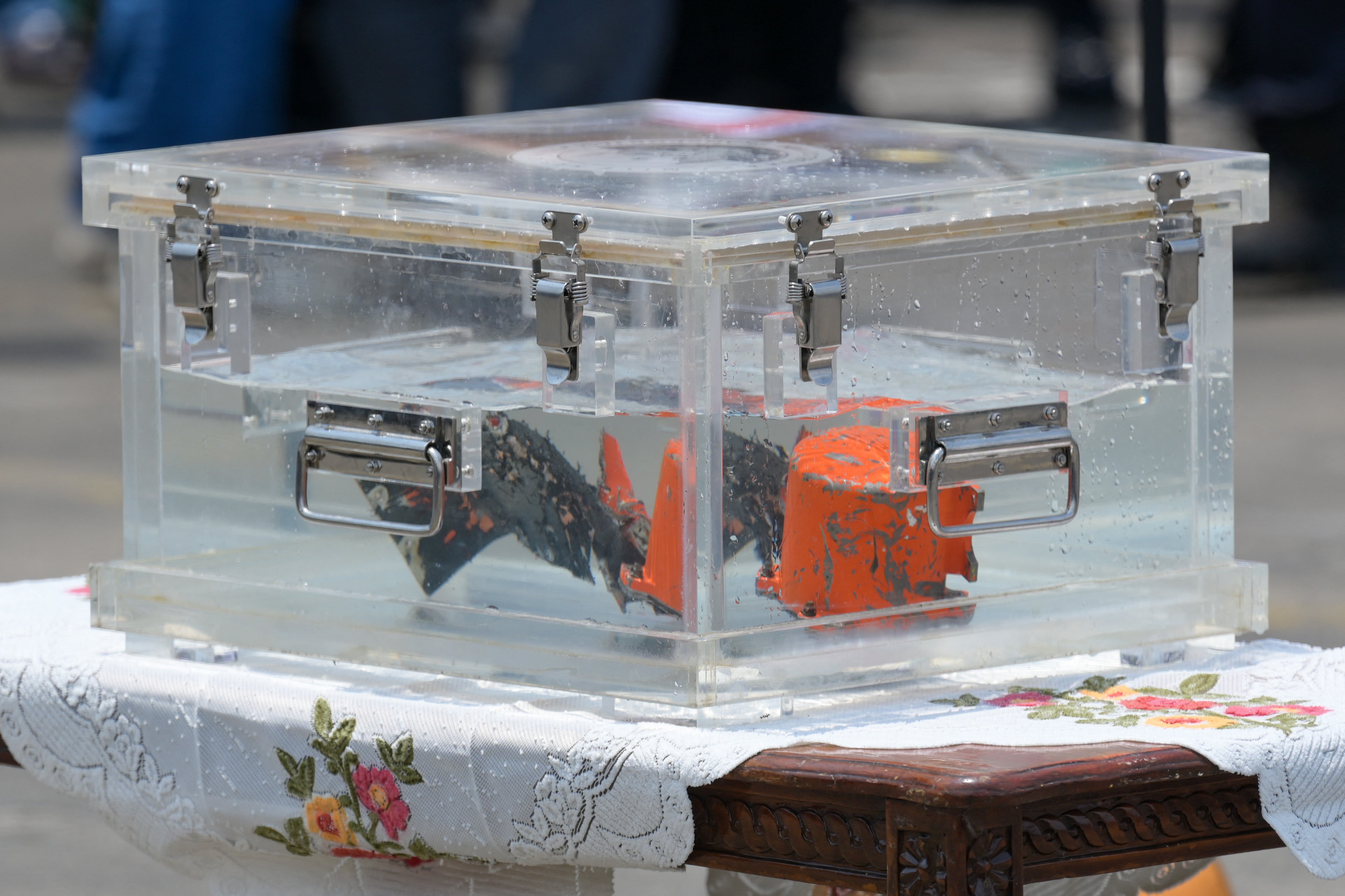 The cockpit voice recorder placed on a table at a port in Jakarta, on 31 March, 2021, after it was recovered during search operations for Sriwijaya jet