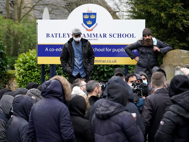 Protesters gathered outside the gates of Batley Grammar School after a teacher was suspended for showing an image of the Prophet Muhammad in class,