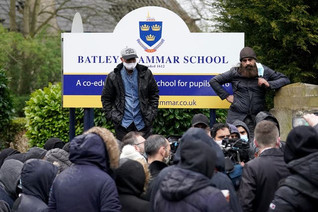 Protesters gathered outside the gates of Batley Grammar School after a teacher was suspended for showing an image of the Prophet Muhammad in class,