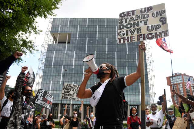 Demonstrators take part in a Black Lives Matter protest outside the US Embassy in London last July