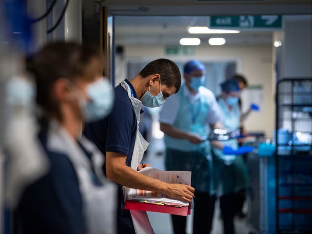<p>NHS workers await patients at the height of the pandemic.</p>