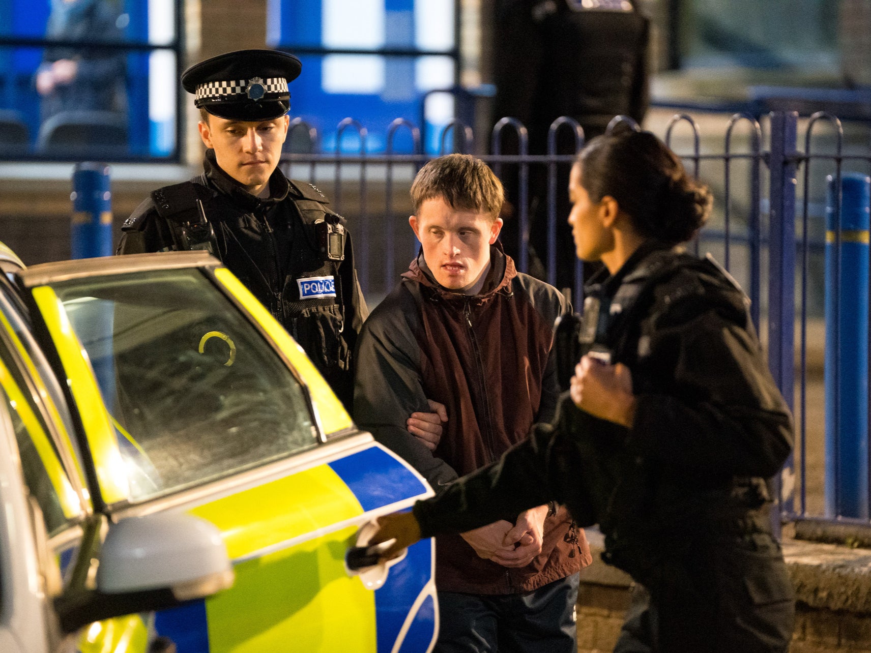 Terry Boyle (Tommy Jessop) being taken into custody by Ryan Pilkington (Gregory Piper)