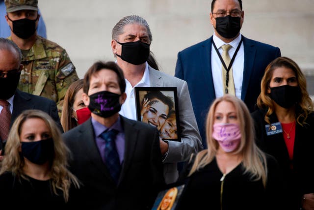 Steve Filson, whose daughter Jessica Filson died in January 2020 of opioids, stands with families who have had relatives die of opioids and authorities during a news conference outside the Roybal Federal Building on February 24, 2021 in Los Angeles, California.