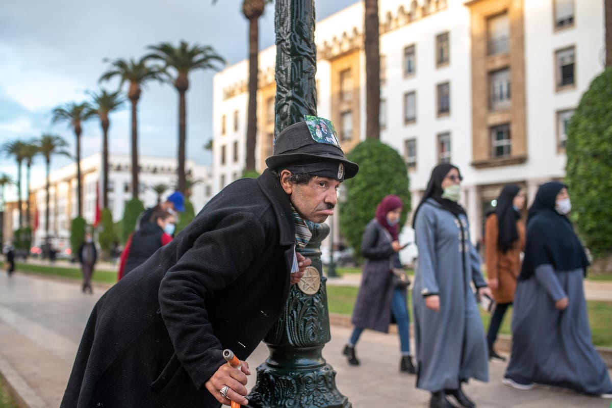 AP PHOTOS: Moroccan mimics Charlie Chaplin to mask hardships