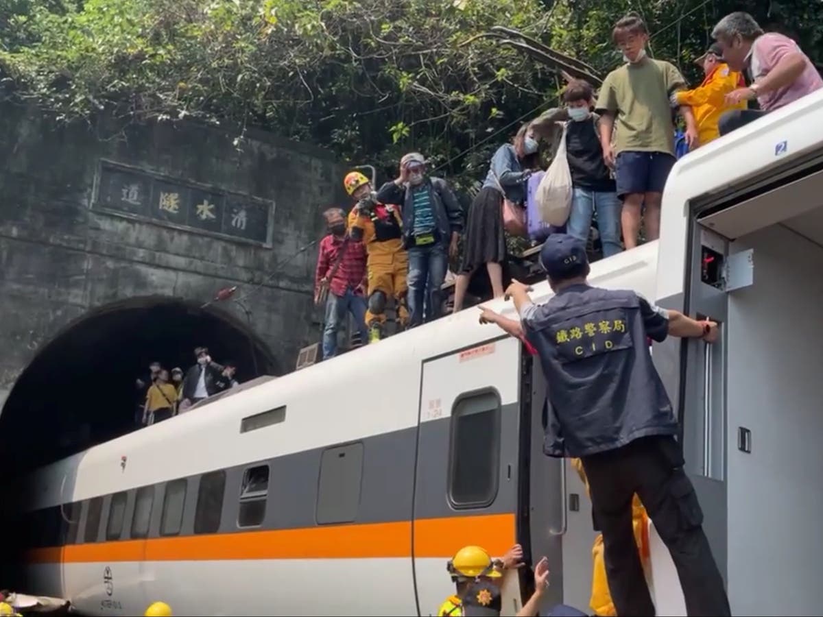 Taiwan train crash: At least 48 killed after service smashes into truck and derails in tunnel