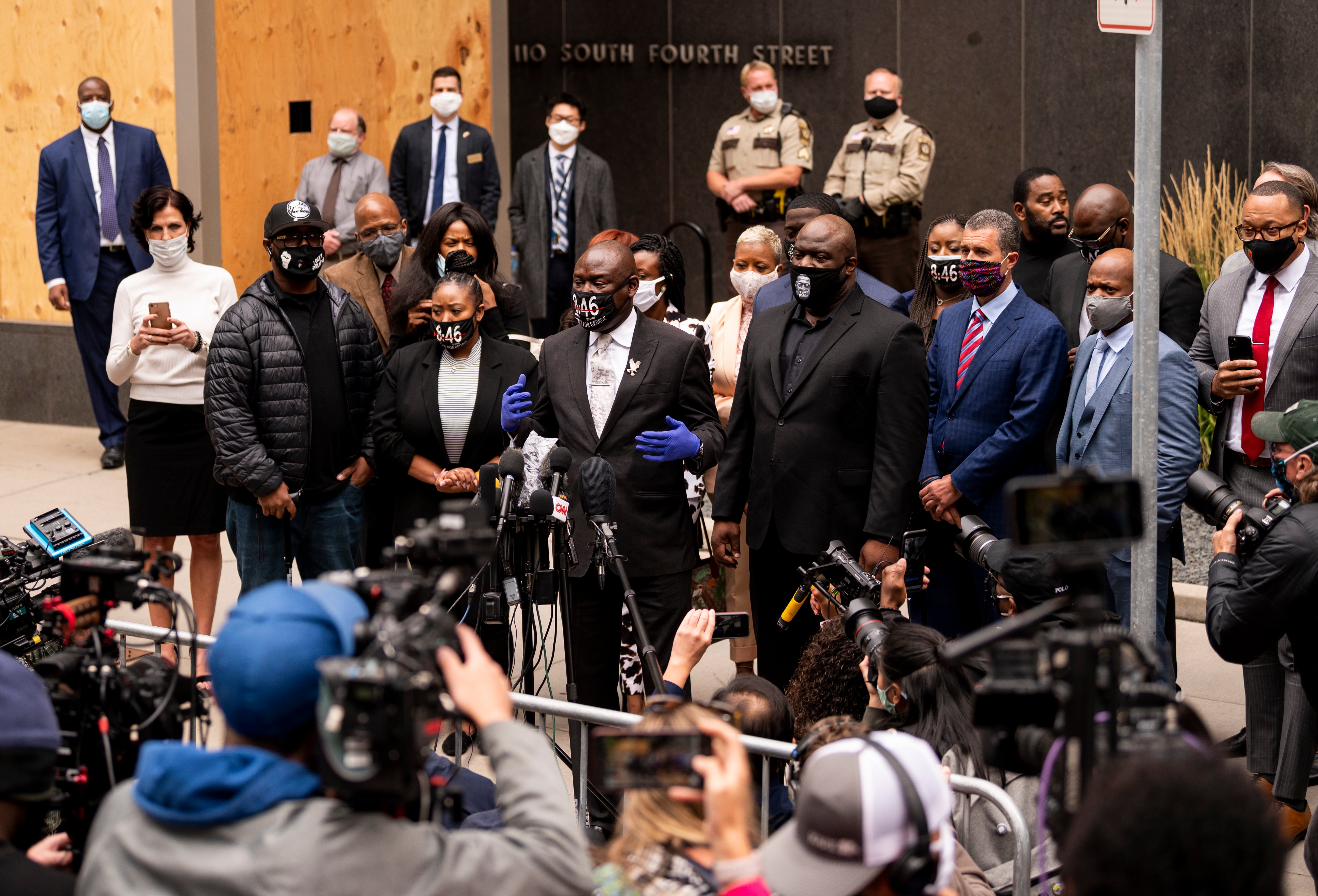 MINNEAPOLIS, MN - SEPTEMBER 11: Attorney Ben Crump (C), surrounded by family of George Floyd, speaks to media gathered outside the Hennepin County Family Justice Center after a pretrial hearing for the four former Minneapolis Police officers charged in the death of George Floyd on September 11, 2020 in Minneapolis, Minnesota. Crump is representing George Floyd's family.