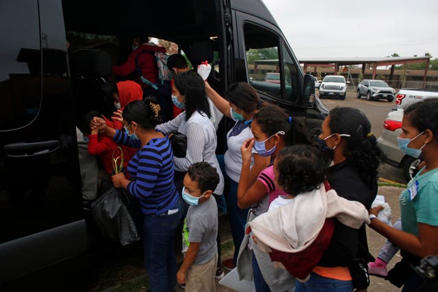 <p>Migrants board a van at a Catholic church in Texas on Palm Sunday</p>