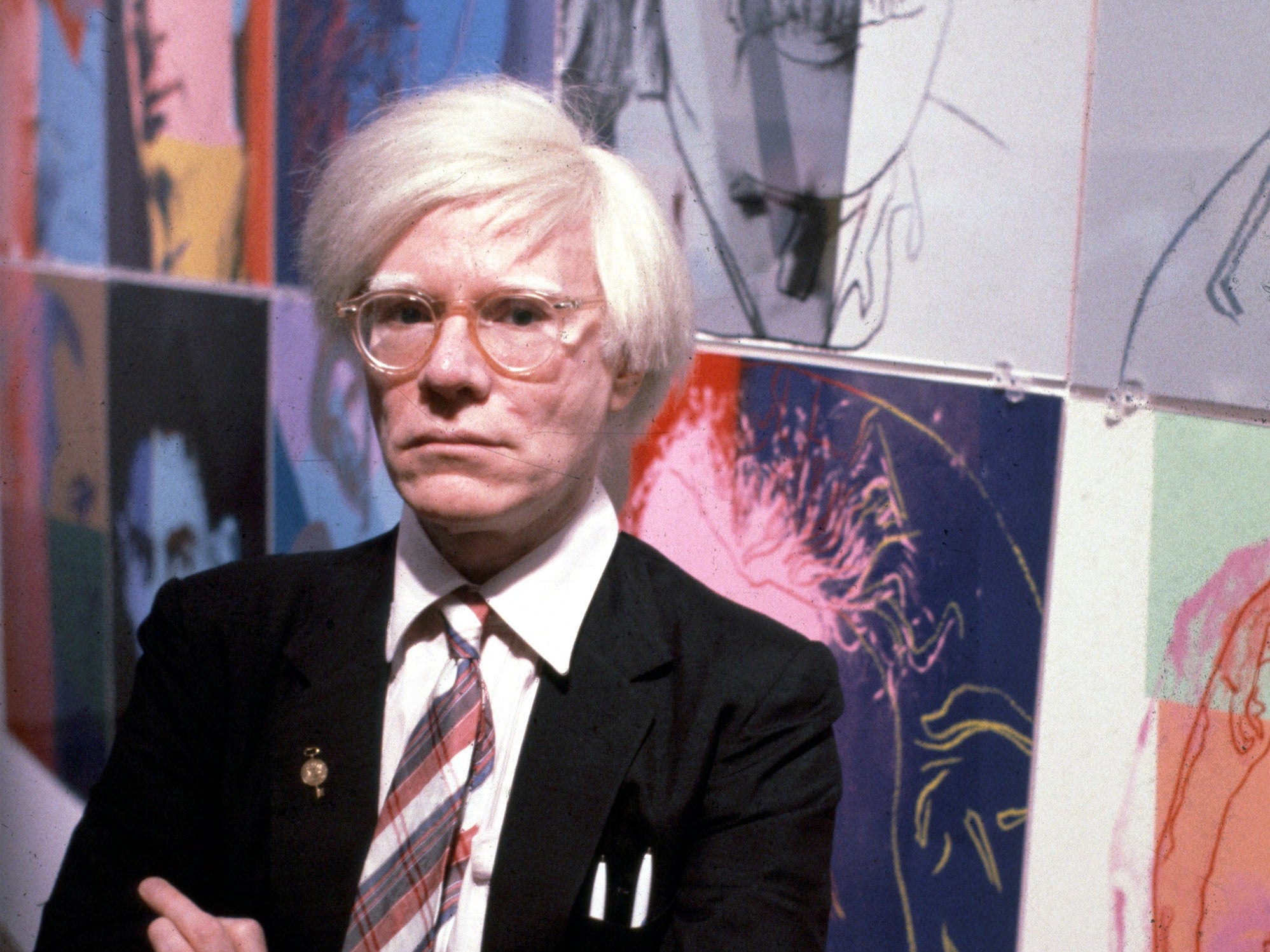 The American artist and filmmaker Andy Warhol with his paintings(1928 - 1987), December 15, 1980