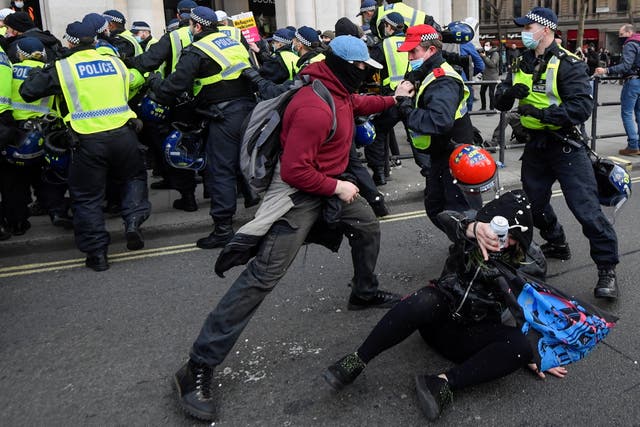 <p>Scuffles between protesters and police in London on Saturday</p>