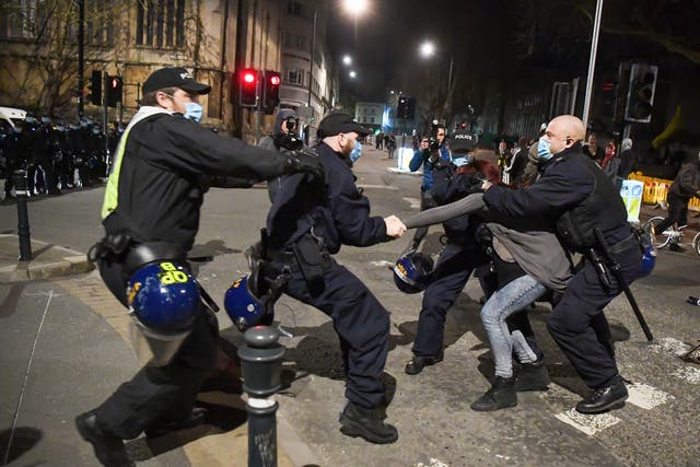 <p>Police officers arrest a protester during a Kill The Bill demonstration in Bristol this week</p>