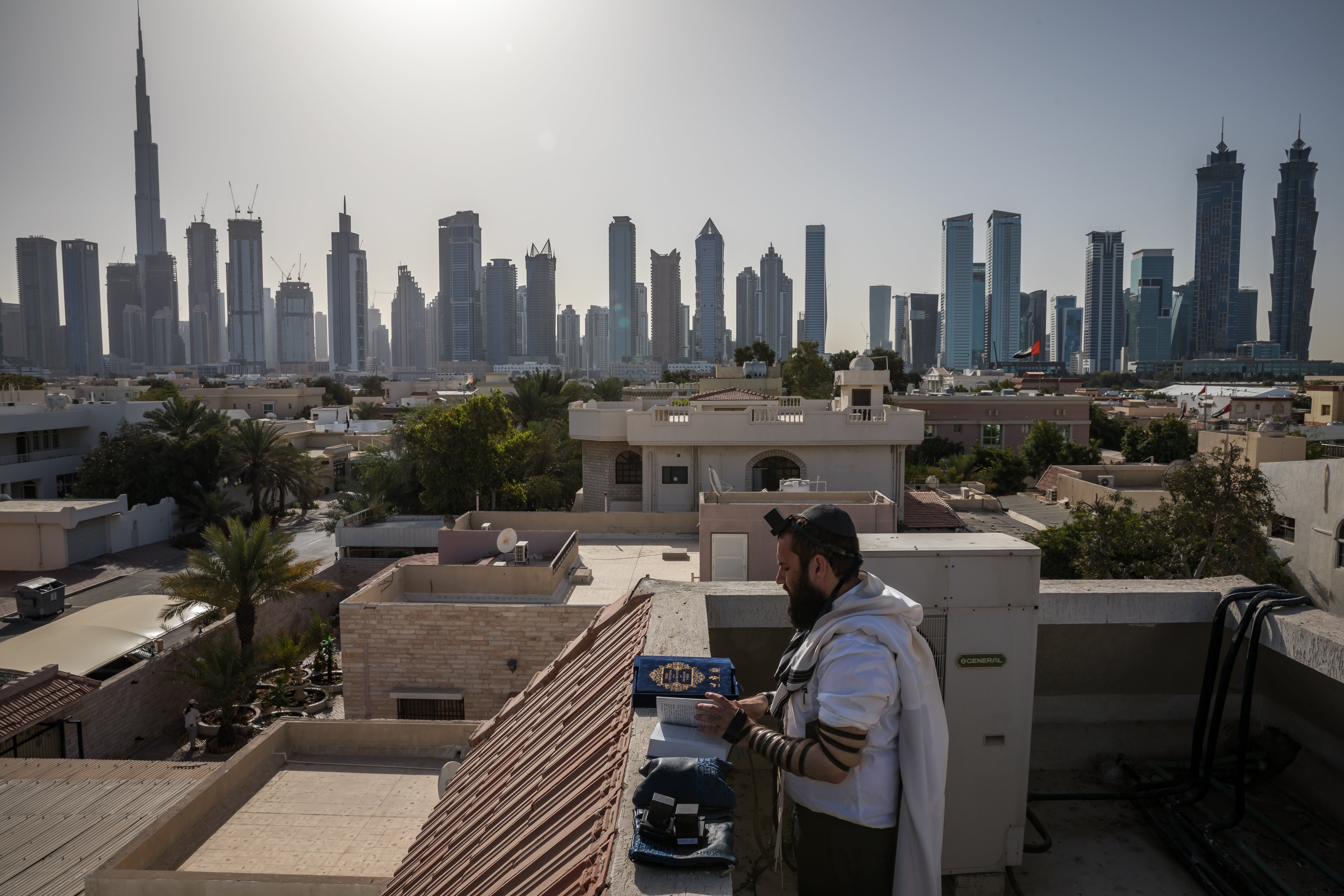 Rabbi Levi Duchman performs morning prayers on the roof of the Jewish Community Center of the UAE