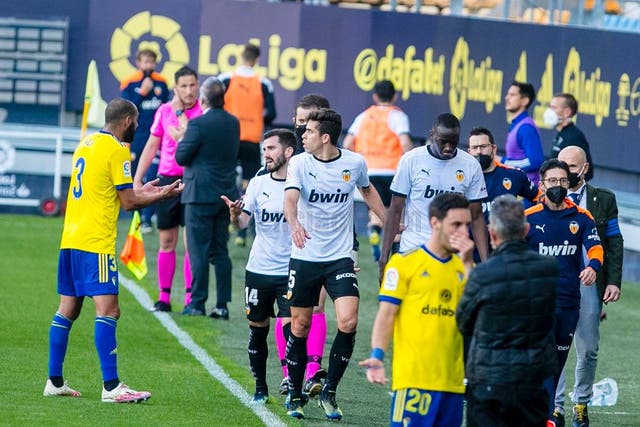 <p>Mouctar Diakhaby and his Valencia team-mates leave the pitch</p>