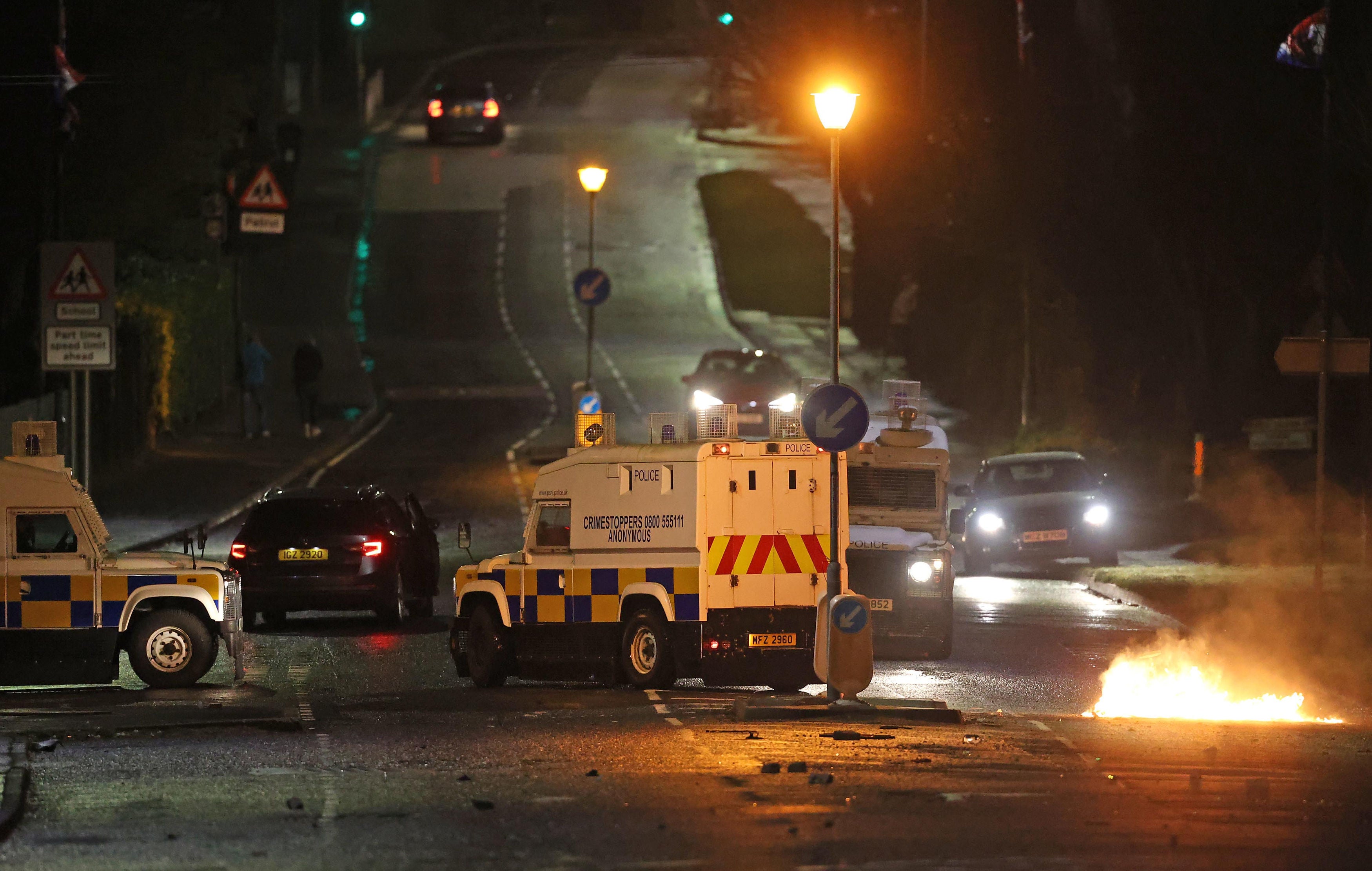 Petrol bombs were thrown at police in Newtownabbey and Carrickfergus on Sunday night