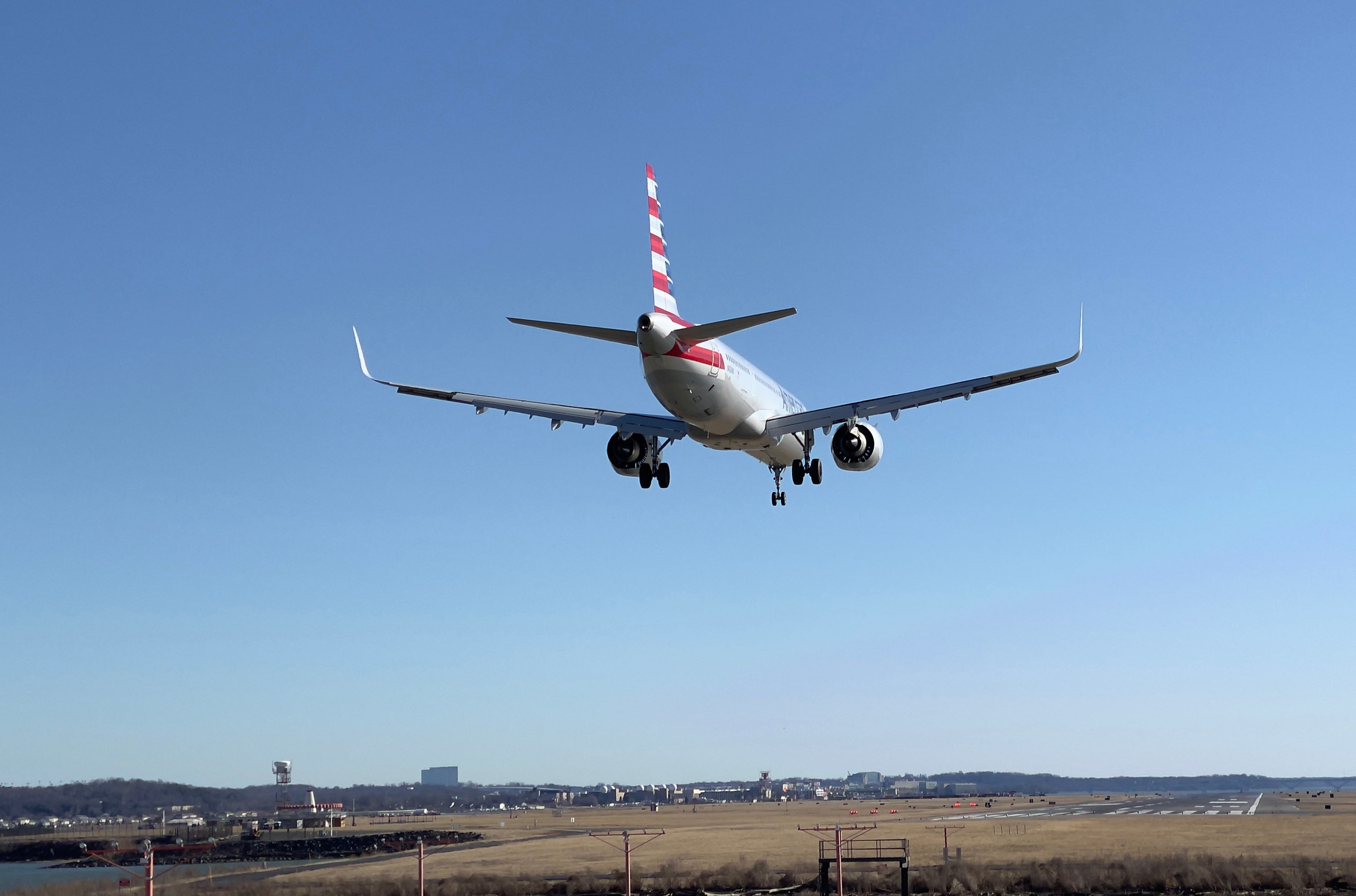 File: An American Airlines plane approaches Washington Ronald Reagan National Airport in Arlington, Virginia on 24 February, 2021