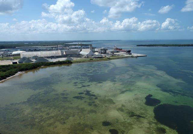 <p>Drone picture of old Piney Point phosphate mine shows a large pond of wastewater that has threatened to flood roads and burst a system that stores polluted waters</p>