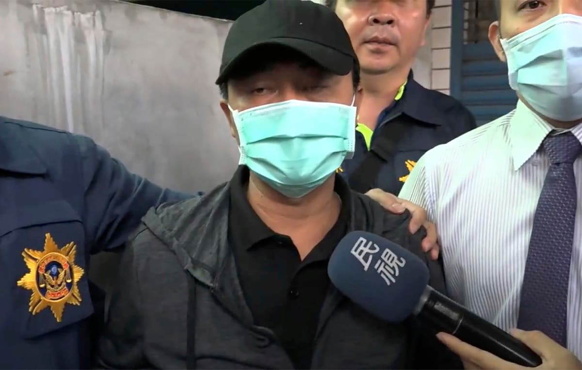 Taiwan truck owner breaks down in tears and apologises as police detain him over deadly train crash