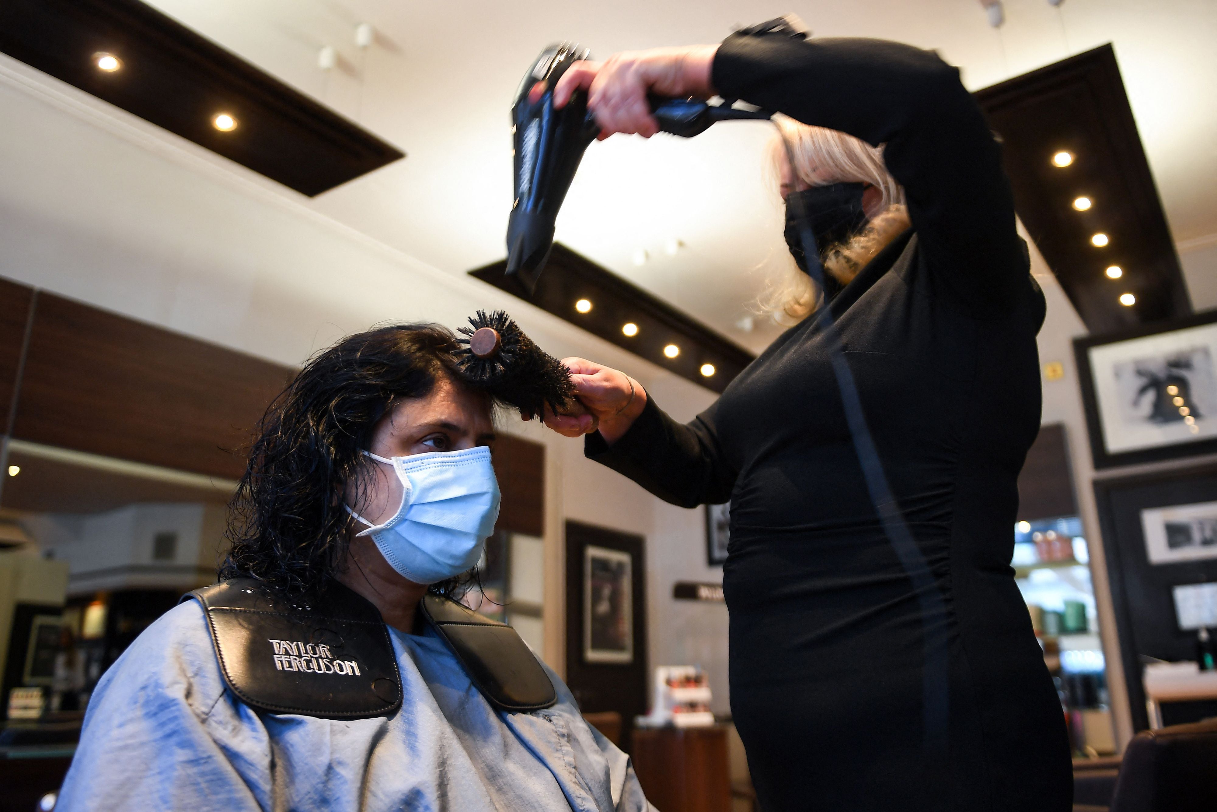 Raj Gill has her hair cut at Taylor Ferguson hair salon in Glasgow