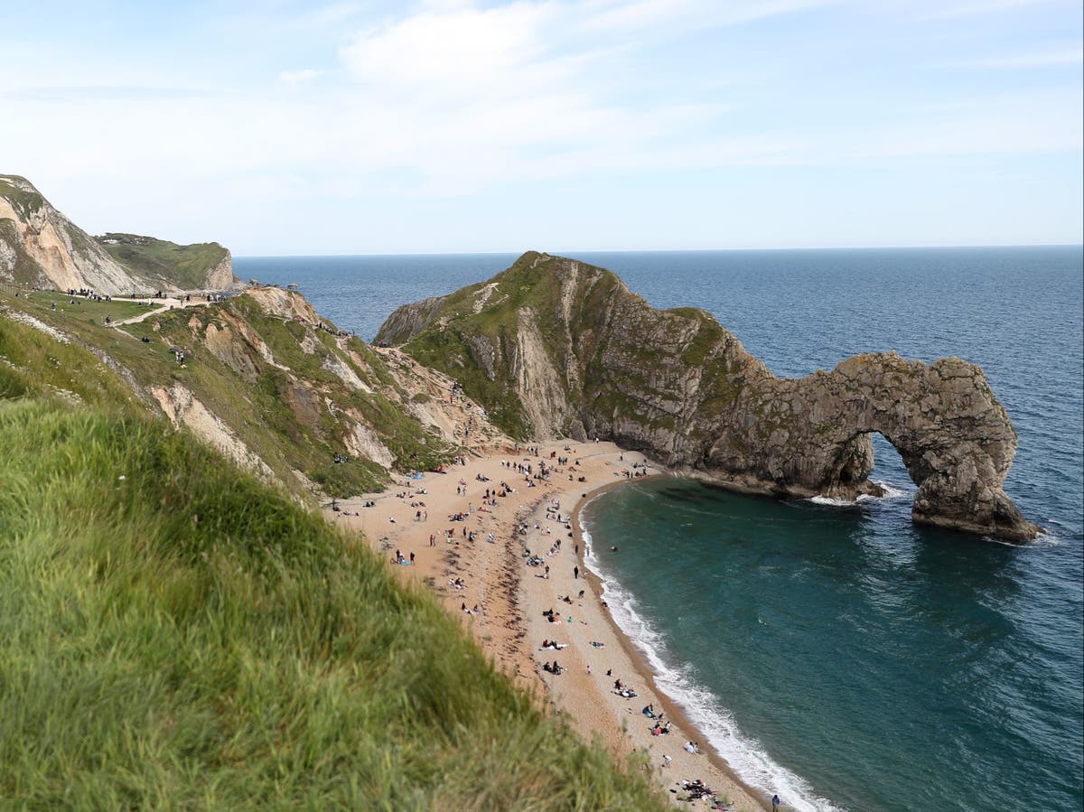 Parachute pair leap 200ft from Durdle Door