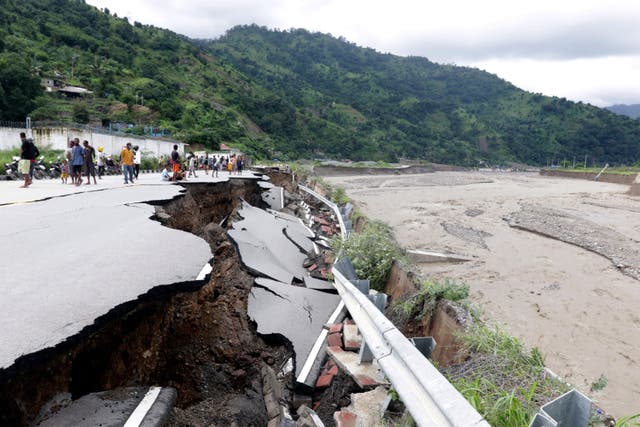 <p>Roads caved in, bridges collapsed and dams overflowed after flash floods pounded Indonesia and Timor-Leste</p>