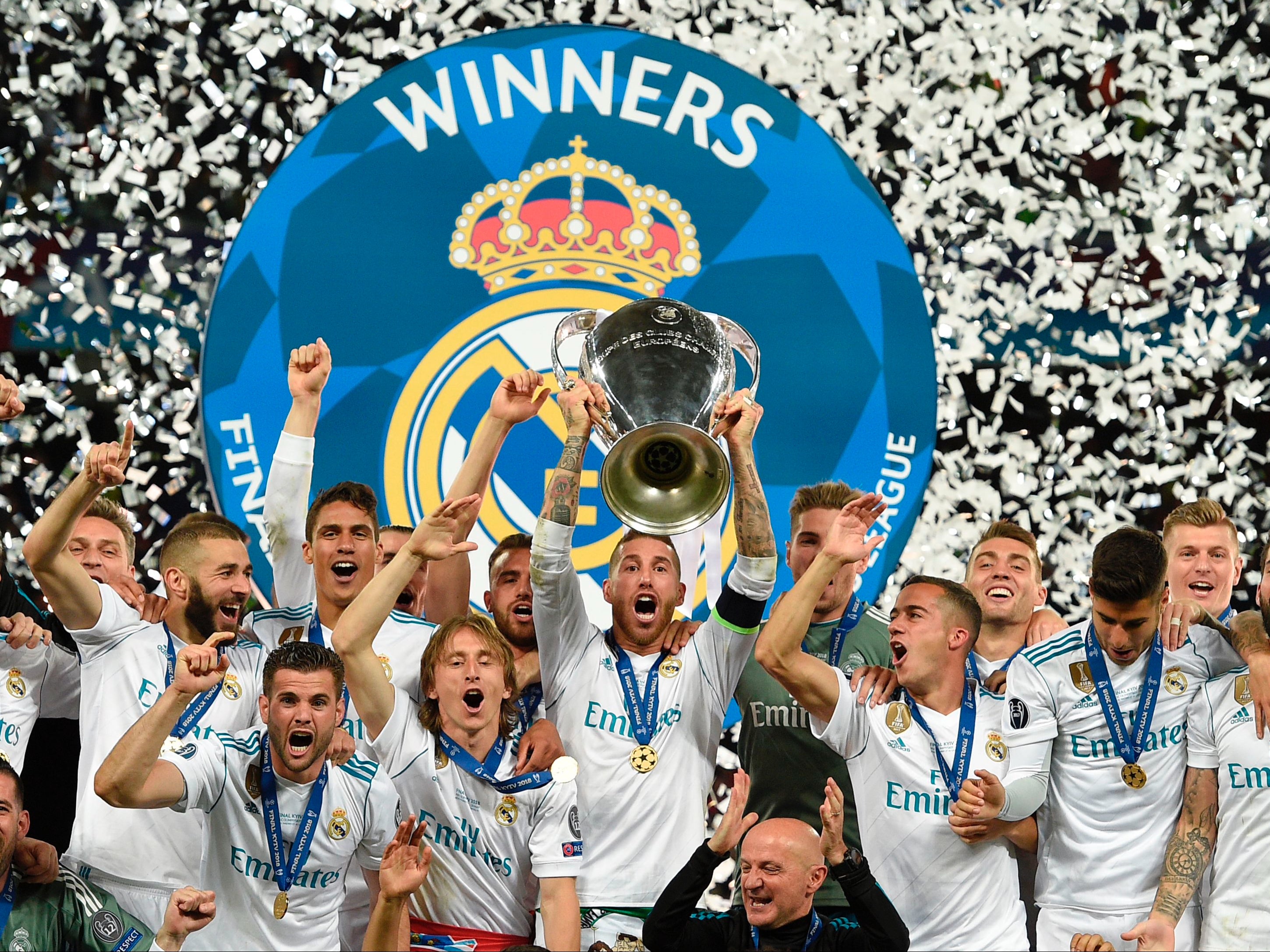 Sergio Ramos holds the trophy aloft in 2018
