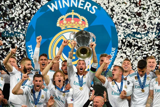 Sergio Ramos holds the trophy aloft in 2018