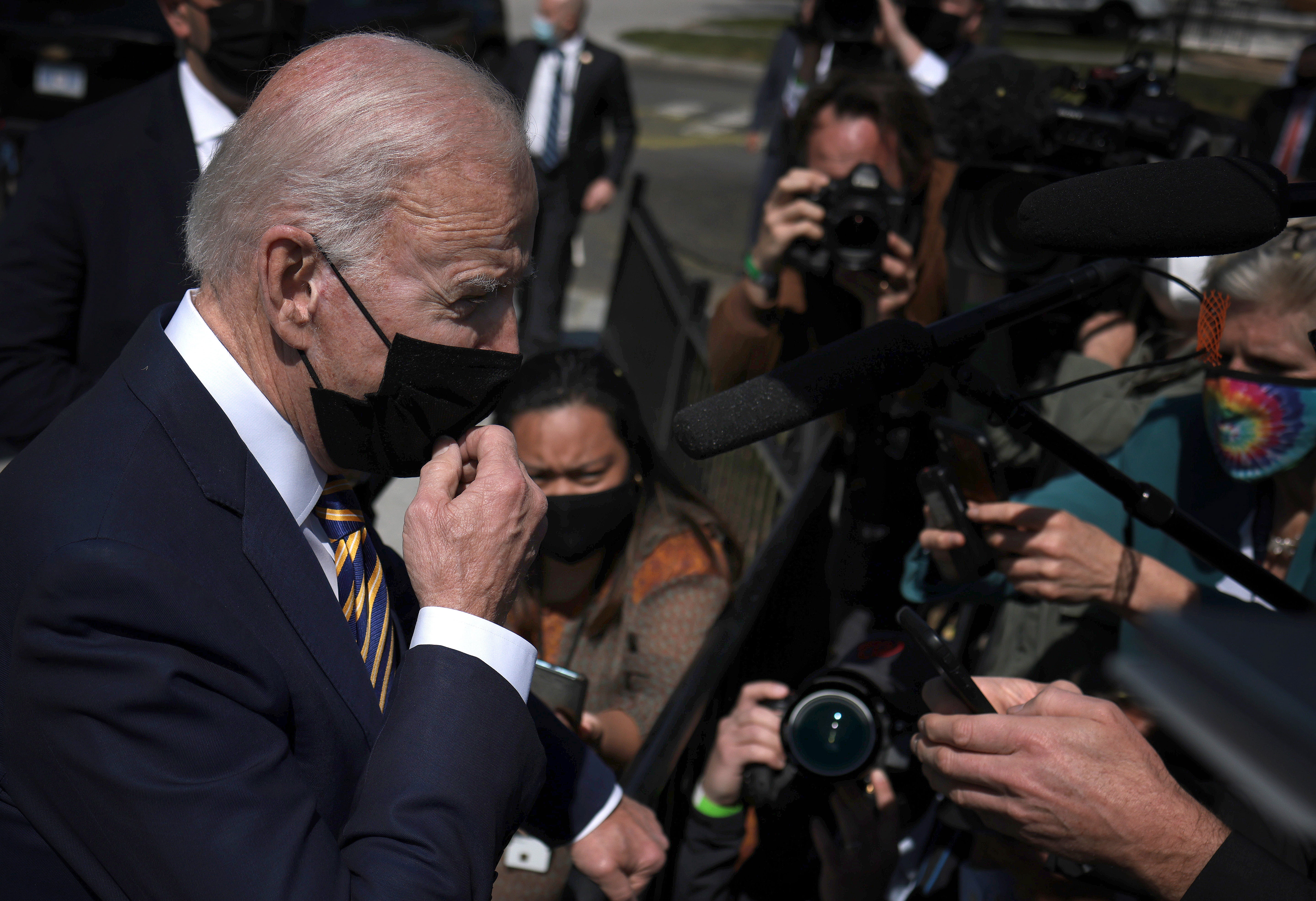 <p>US President Joe Biden answers questions while returning to the White House on April 05, 2021 in Washington, DC</p>