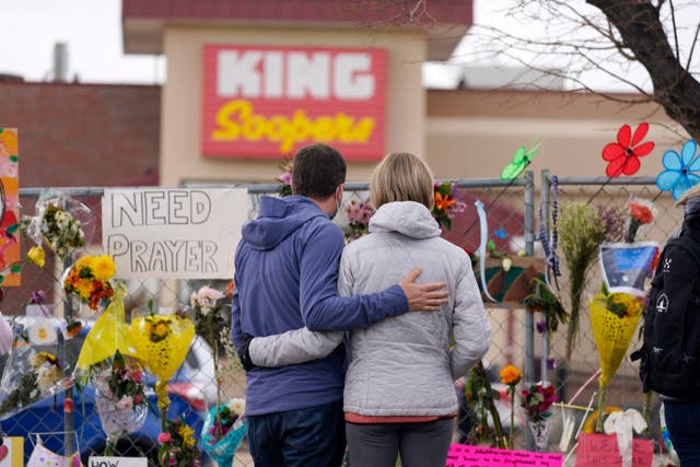 <p>Mourners outside of the King Soopers grocery store in Boulder, Colorado</p>