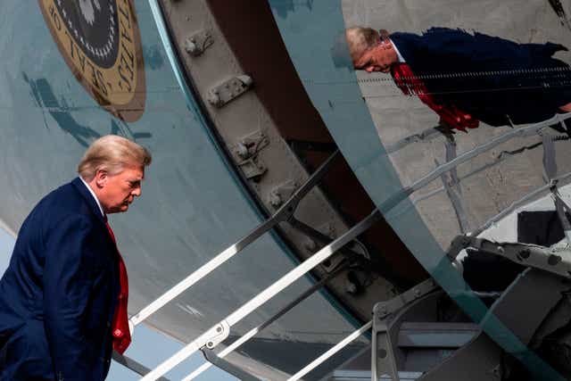 <p>File Image: The then-US President Donald Trump boards Air Force One while departing from Palm Beach International Airport in December 2020</p>