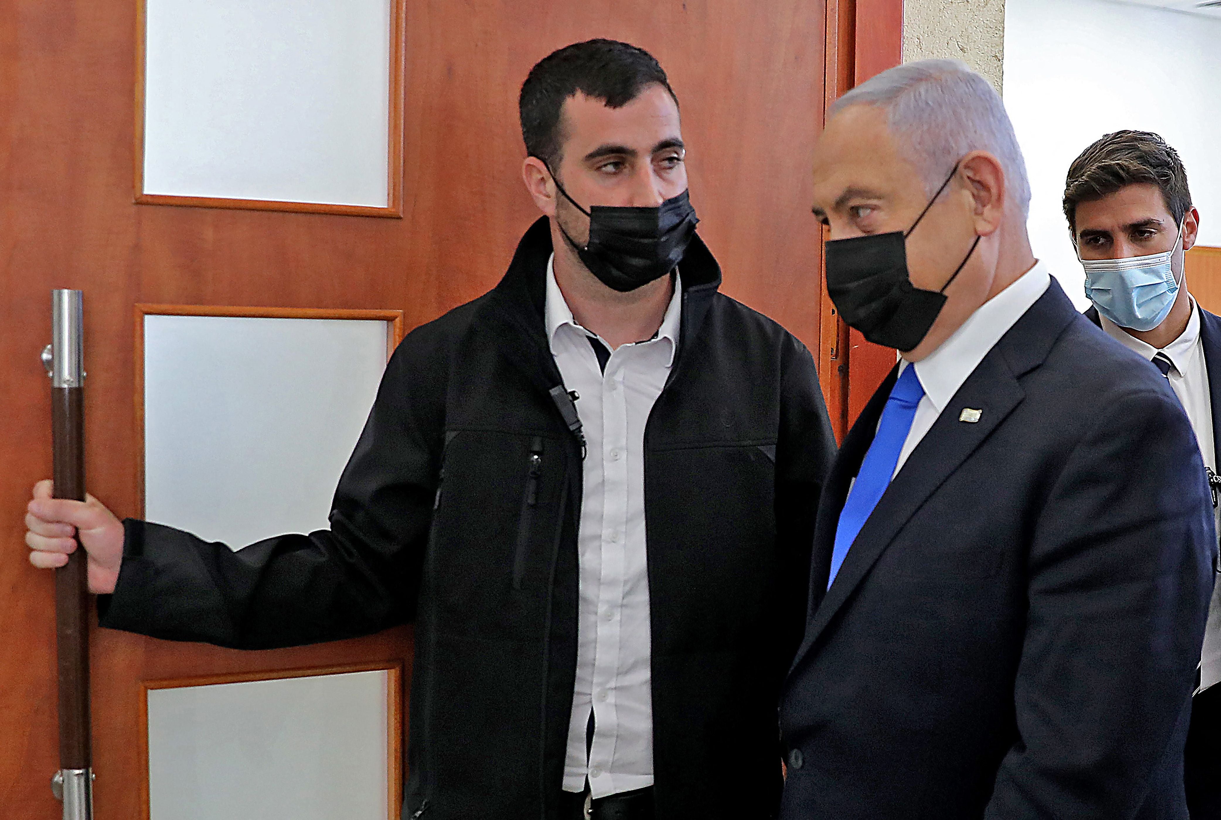 Netanyahu leaves the courtroom on Monday during his trial on corruption charges