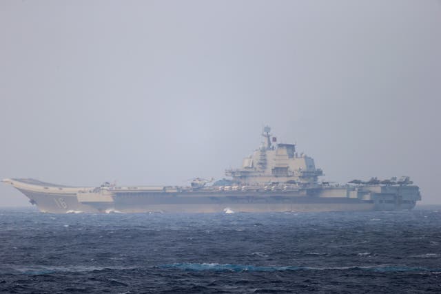 <p>Chinese aircraft carrier Liaoning sails through the Miyako Strait on 4 April, 2021 in this handout photo by the Joint Staff Office of the Defense Ministry of Japan</p>