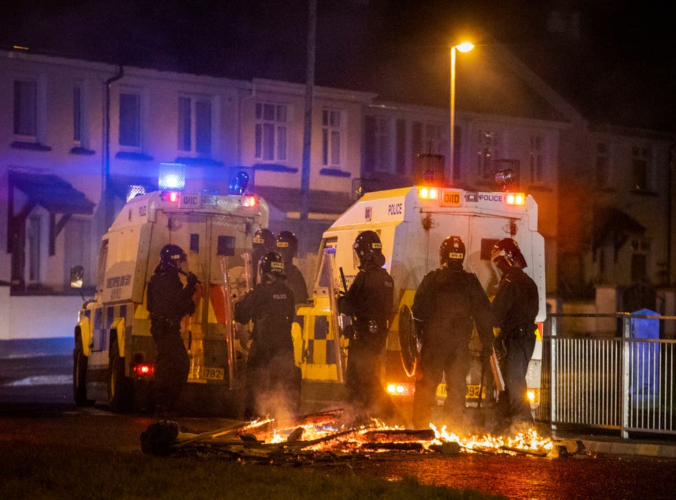 <p>PSNI Tactical Support Group officers in attendance at the loyalist Nelson Drive estate in the Waterside of Derry City, Co. Londonderry, during a public order incident which saw a car being set alight and surrounding roads being blocked with fires</p>