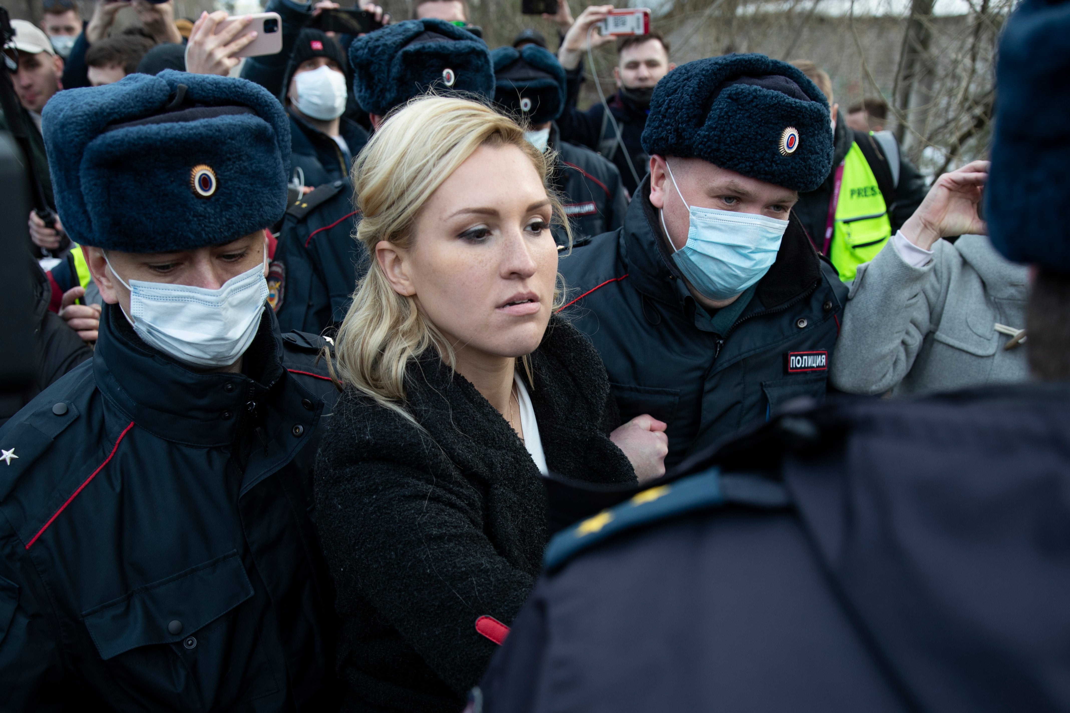 Police officers detain the Alliance of Doctors union’s leader, Anastasia Vasilyeva, at the prison colony IK-2 where Alexei Navalny is being held