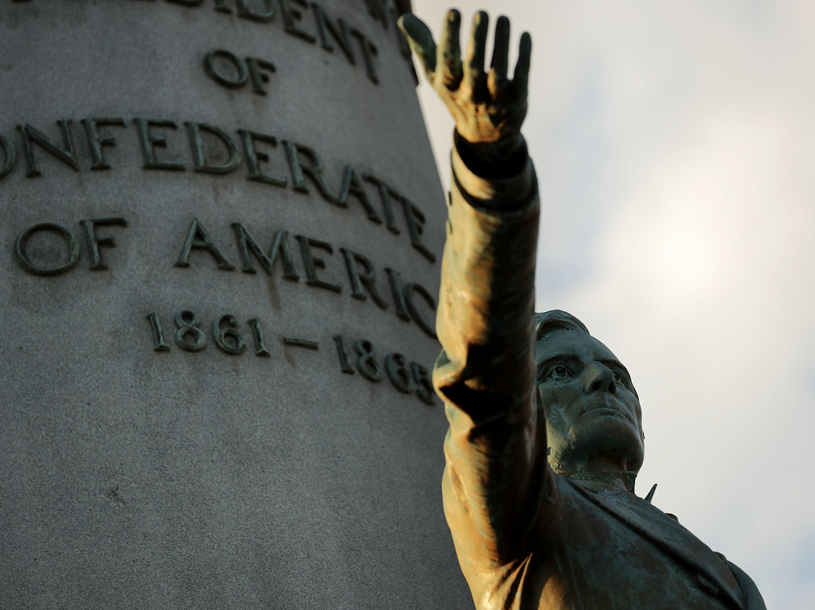 A statue of Confederate President Jefferson Davis, unveild in 1907, stands in the middle of Monument Avenue 23 August, 2017